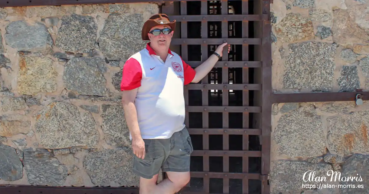 Alan Morris outside a cell at Yuma prison.